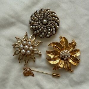 Elegant Gold and Pearl Brooch Collection